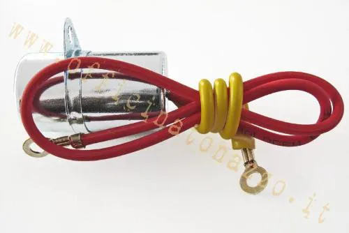 Condensatore CEAB a due fili per statori Vespa a puntine. Equivalente Piaggio 155973; verificare fissaggio e disposizione dei cavi.