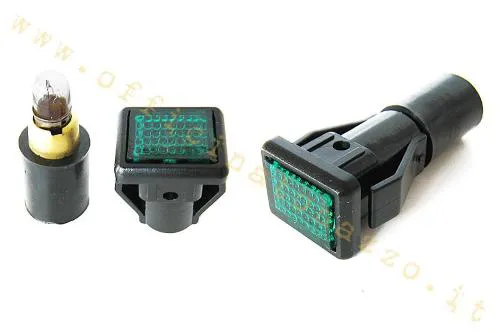 Spia verde controllo luci per coprimanubrio Vespa P e PX-PE prima serie. Verificare corpo, innesto e portalampada prima del montaggio.