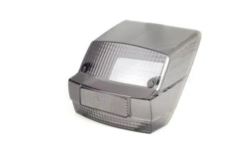 Corpo luminoso posteriore fumè per Vespa PX Arcobaleno 125/150 e P 200 E, serie 1985-2000. Confrontare sagoma e fissaggi prima del montaggio.